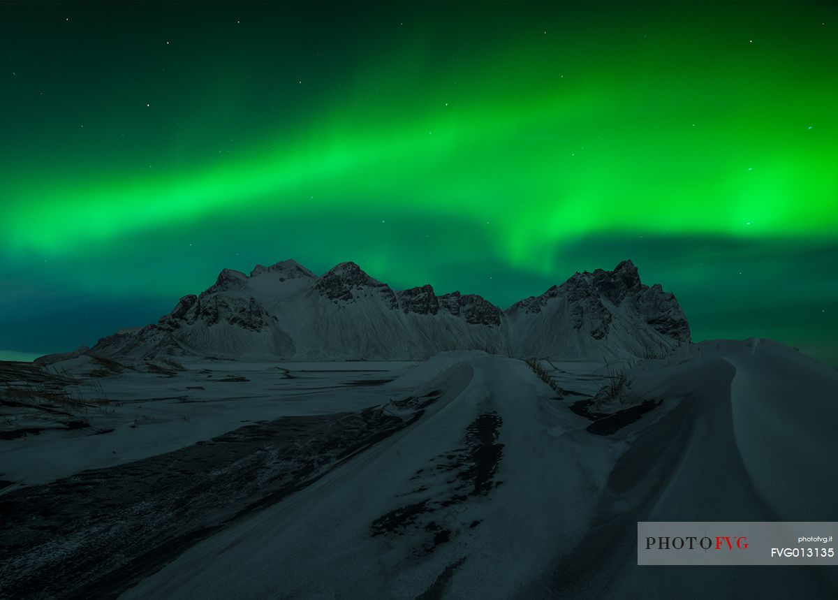 Northern lights over the black beach of Stokksens