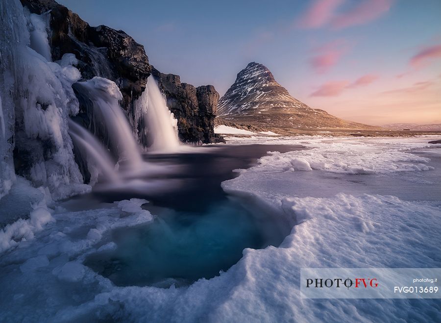 Kirkjufell mountain with water falls at winter, Iceland