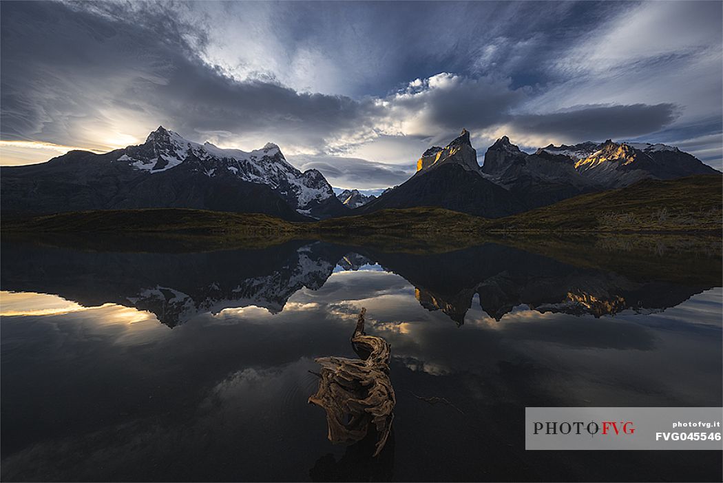 Torres del Paine reflecting in lake Pehoe at sunset, Patagonia, Chile