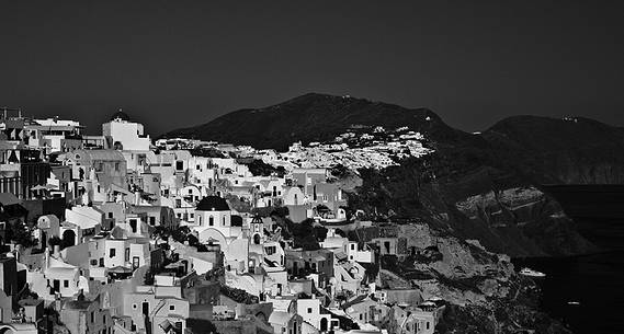 windmill on santorini island on sunset