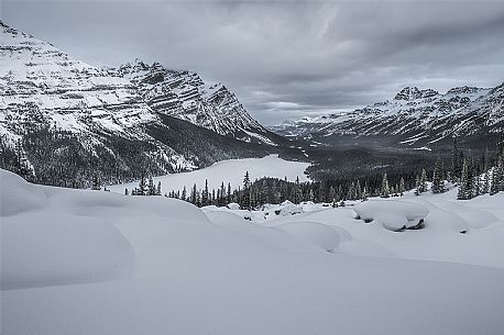Winter in Peyto Lake in Mistaya Valley against Caldron Peak and Mount Patterson, Bow Summit, Banff National Park, Alberta, Canada