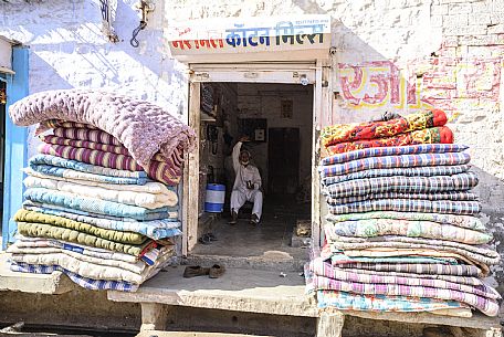 Selling rugs in a small shop, Rajasthan, India, Asia