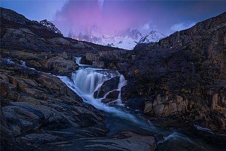 The Fitz Roy mountain range and the waterfall at dawn, Los Glaciares National Park, Santa Cruz province, Andes, Patagonia, Argentina. South America 