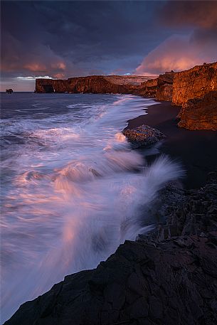 Sunrise from lava beach of Cape Dyrholaey near Vik i Myrdal, Iceland, Europe