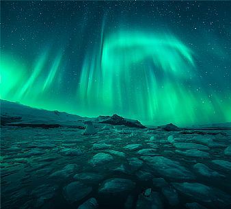 Northern lights above Jokulsarlon glacial lake at Vatnajokull glacier, Iceland, Europe