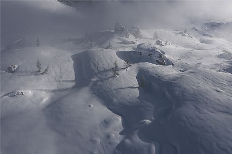 Aerial view of the wild landscape in the snow storm, Cortina d'Ampezzo, Dolomites, Italy, Europe