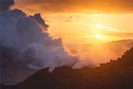 Lava flowing into the Pacific Ocean at sunset, Kilauea Volcano, Hawaii Volcanoes National Park, Big Island, Hawaii, USA