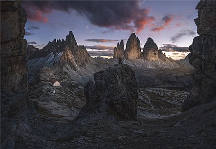 Photographer in front on Tre Cime di Lavaredo peak at sunset, Pusteria valley, dolomites, South Tyrol, Italy, Europe