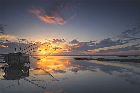 Typical fishing house in the adriatic coast at sunset, Marina di Ravenna, Emilia Romagna, Italy, Europe