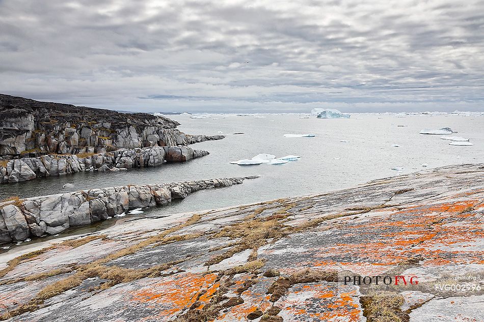 Cliffs of Rodebay a small village of fishermen and seal hunters in Disko Bay