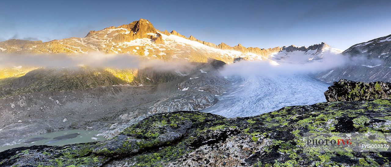 Rhone glacier and melting lake at dawn, Furka pass, Valais, Switzerland, Europe