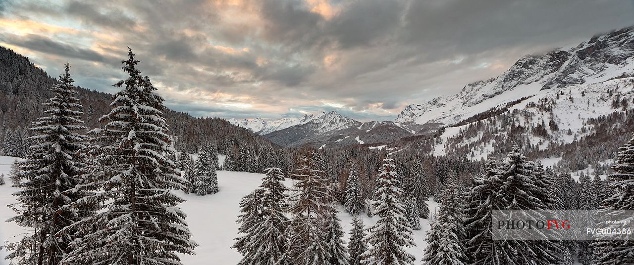 Zoldana Valley and Civetta Mountain group at dawn after a night snowfall