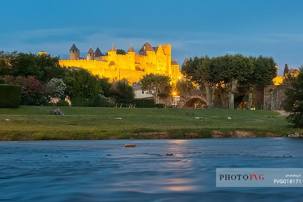 View of the mediavel ancient city of Carcassonne at night time from Aude river