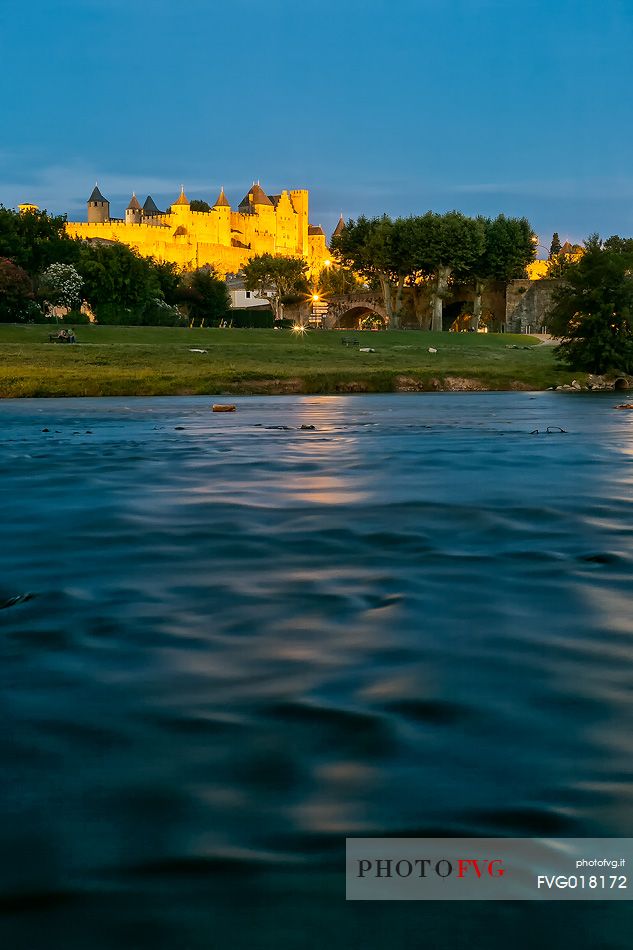 View of the mediavel ancient city of Carcassonne at night time from Aude river