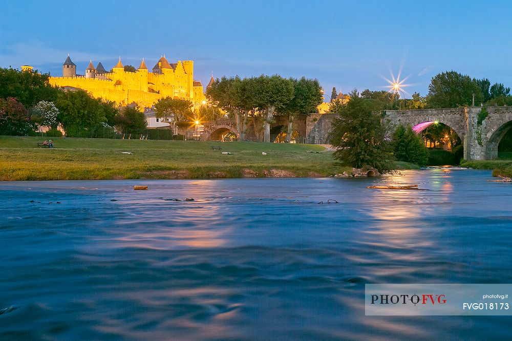 View of the mediavel ancient city of Carcassonne at night time from Aude river