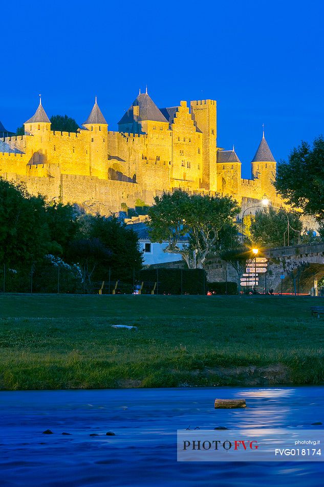 View of the mediavel ancient city of Carcassonne at night time from Aude river