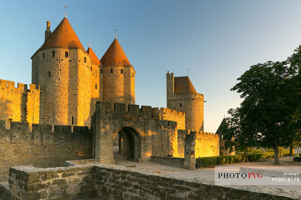 The mediavel ancient city of Carcassonne in warm light of sunrise