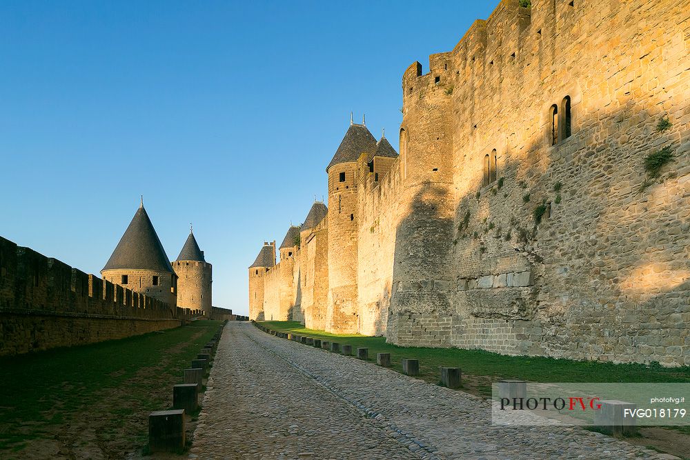 The mediavel ancient city of Carcassonne in warm light of sunrise