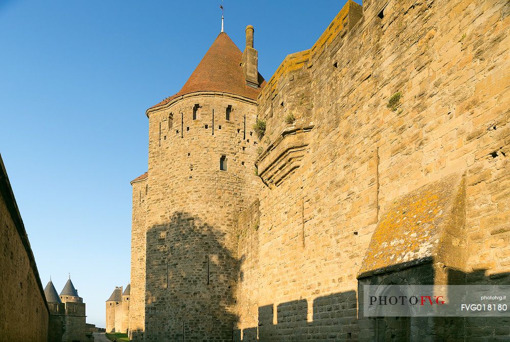 The mediavel ancient city of Carcassonne in warm light of sunrise