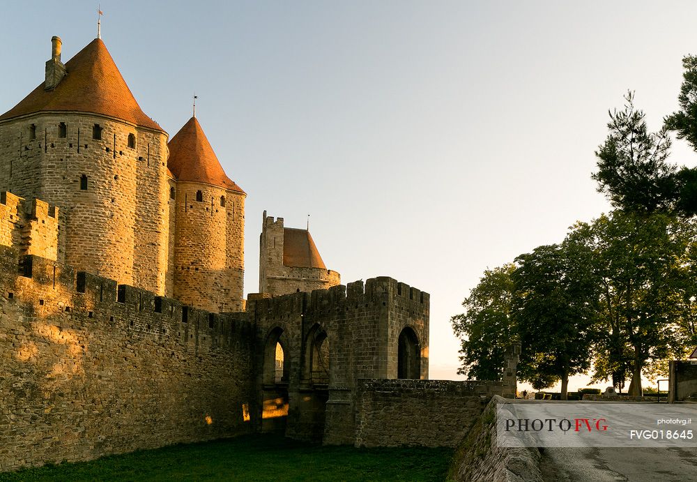The mediavel ancient city of Carcassonne in warm light of sunrise