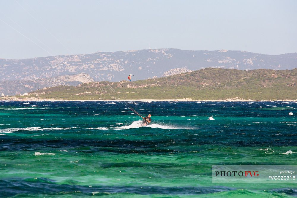 Kitesurf  in the water of Tonnara beach, Corse, France, Europe