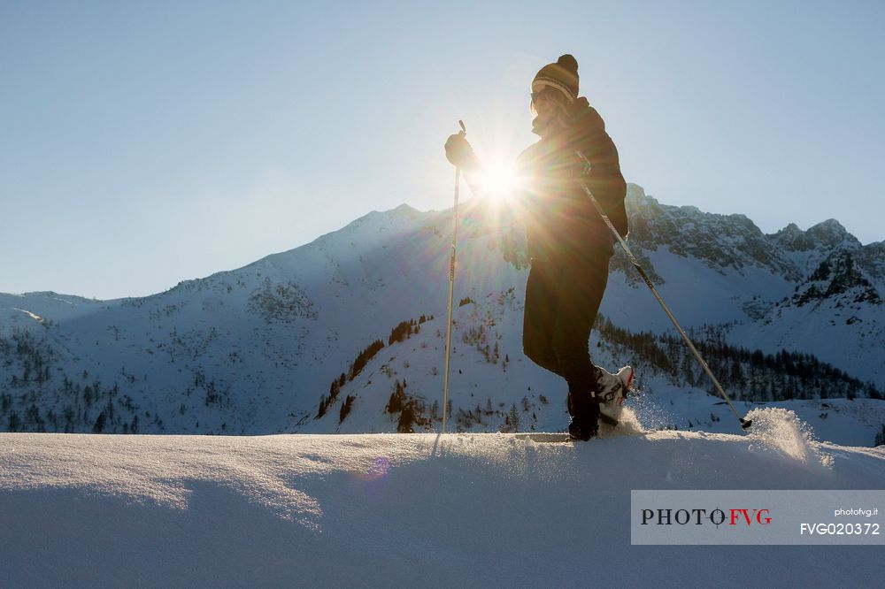 Bivera mountain at sunset. Trekking with snowshoes near Casera Razzo, Sauris