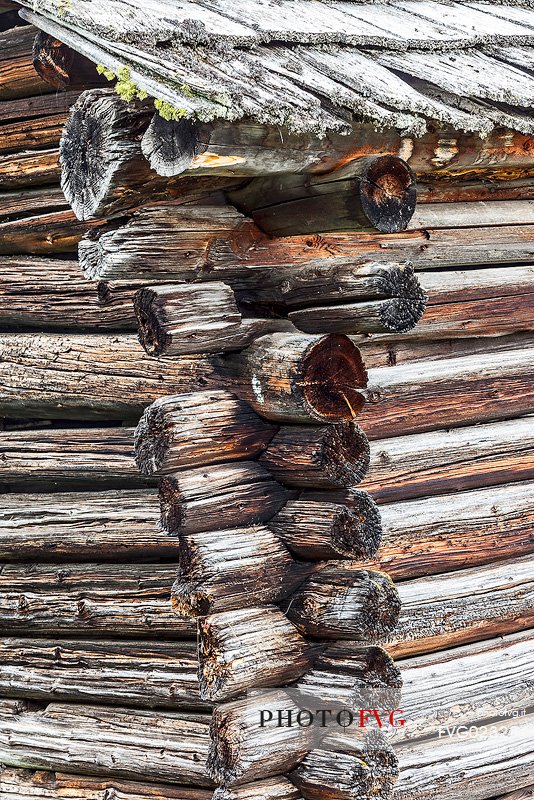 Closeup of corner of a typical wooden building in a alpine village, Badia Valley, dolomites, Italy