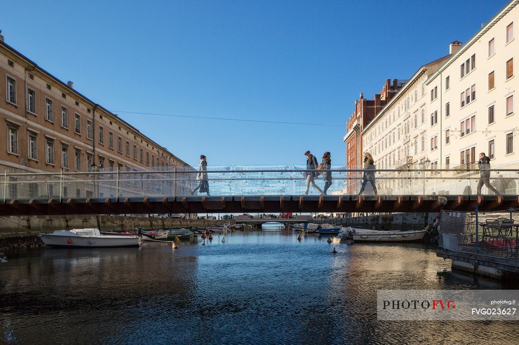 People over the bridge of Canal grande in Trieste city center, Italy, Europe