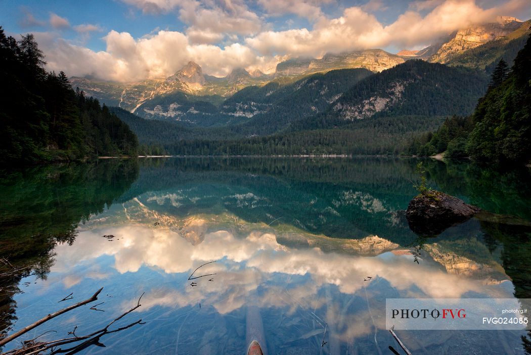 Sunrise at Tovel lake and the Brenta's dolomites, Val di Non, Trentino, Italy