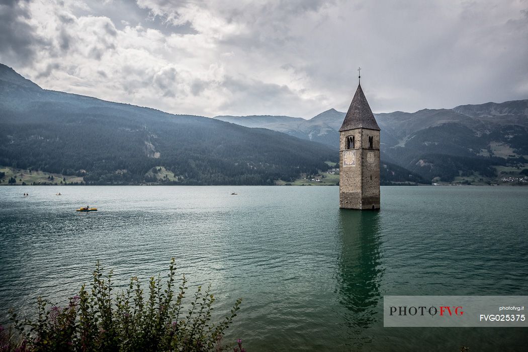 The bell tower in the Resia lake, South Tyrol, Italy
