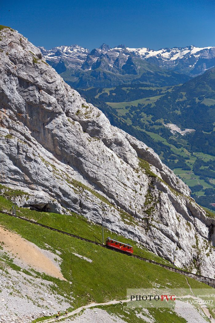 The red Cogwheel Railway going up Pilatus Mountain, Border Area between the Cantons of Lucerne, Nidwalden and Obwalden, Switzerland, Europe