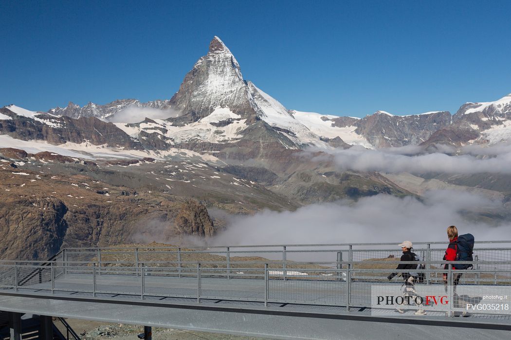 Hikers at the Gornergrat, in the background the Matterhorn or Cervino mount, Zermatt, Valais, Switzerland, Europe
