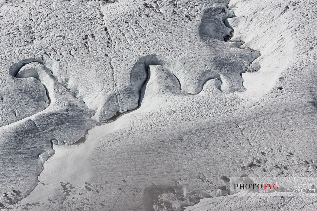 Detail of stream in the Gorner glacier from Gornergrat mountain top, Monte Rosa or Breithorn mountain range, Zermatt, Valais, Switzerland, Europe
 