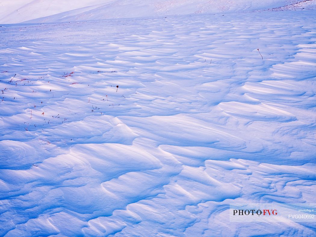 Snowy waves in a meadow, Pizzoc mount, Cansiglio, Veneto, Italy, Europe