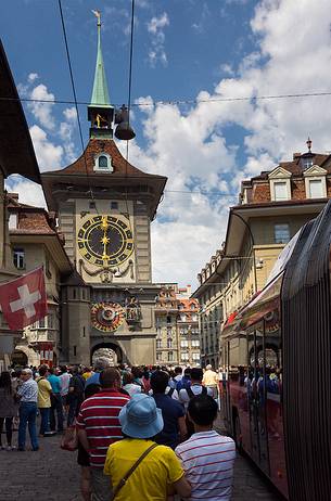 Tourists admiring the Clock tower or Zytglogge clock in the Kramgasse street, downtown of Bern, Unesco World Heritage, Switzerland, Europe Tourists admiring the Clock tower or Zytglogge clock in the Kramgasse street, downtown of Bern, Unesco World Heritage, Switzerland, Europe