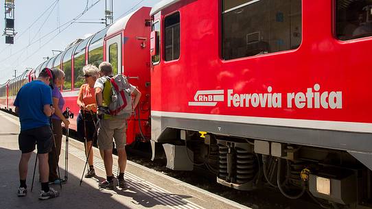Tourists at the Bernina pass station with Bernina Express train, Rhetic railways, Engadin, Canton of Grisons, Switzerland, Europe
