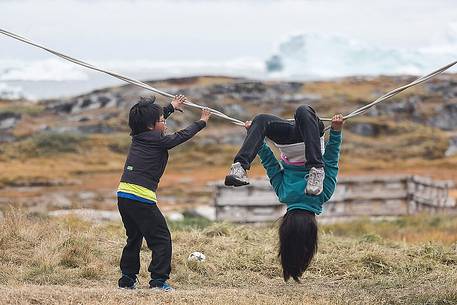 Children play in Rodebay a small village of fishermen and seal hunters in Disko Bay