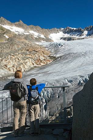 Tourists at the Rhone glacier, Furka pass, Valais, Switzerland, Europe
