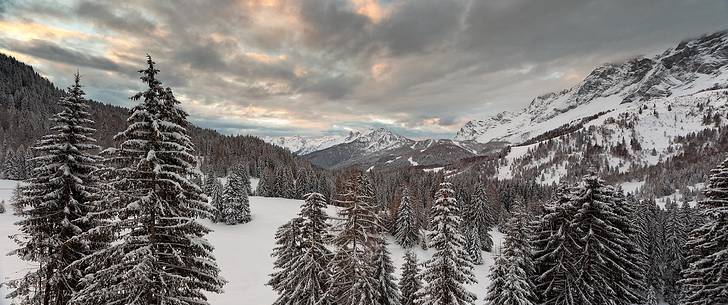 Zoldana Valley and Civetta Mountain group at dawn after a night snowfall