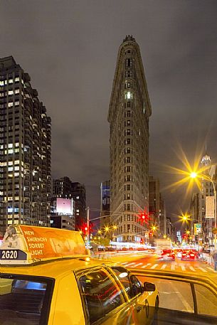 POV taxi at night with Flatiron building in the background
