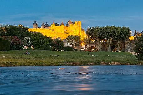 View of the mediavel ancient city of Carcassonne at night time from Aude river