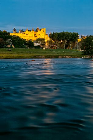 View of the mediavel ancient city of Carcassonne at night time from Aude river