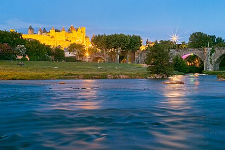 View of the mediavel ancient city of Carcassonne at night time from Aude river