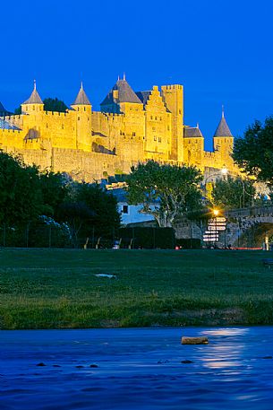 View of the mediavel ancient city of Carcassonne at night time from Aude river