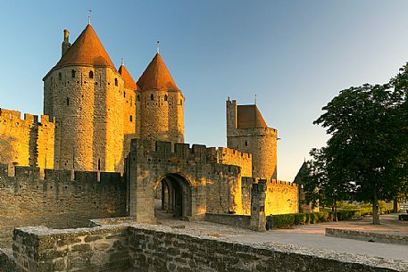 The mediavel ancient city of Carcassonne in warm light of sunrise