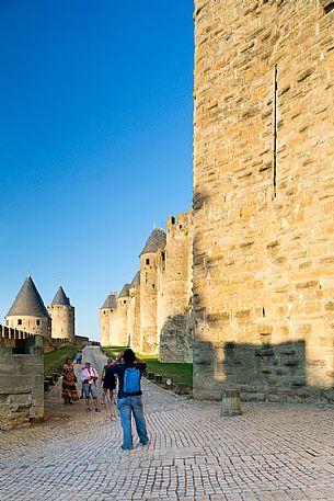 Tourists visiting the mediavel ancient city of Carcassonne at morning