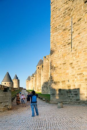 Tourists visiting the mediavel ancient city of Carcassonne at morning Tourists visiting the mediavel ancient city of Carcassonne at morning