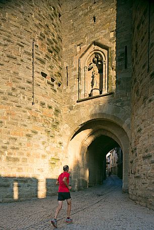 Tourists visiting the mediavel ancient city of Carcassonne at morning