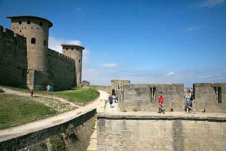 Tourists visiting the mediavel ancient city of Carcassonne at morning