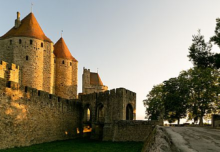 The mediavel ancient city of Carcassonne in warm light of sunrise